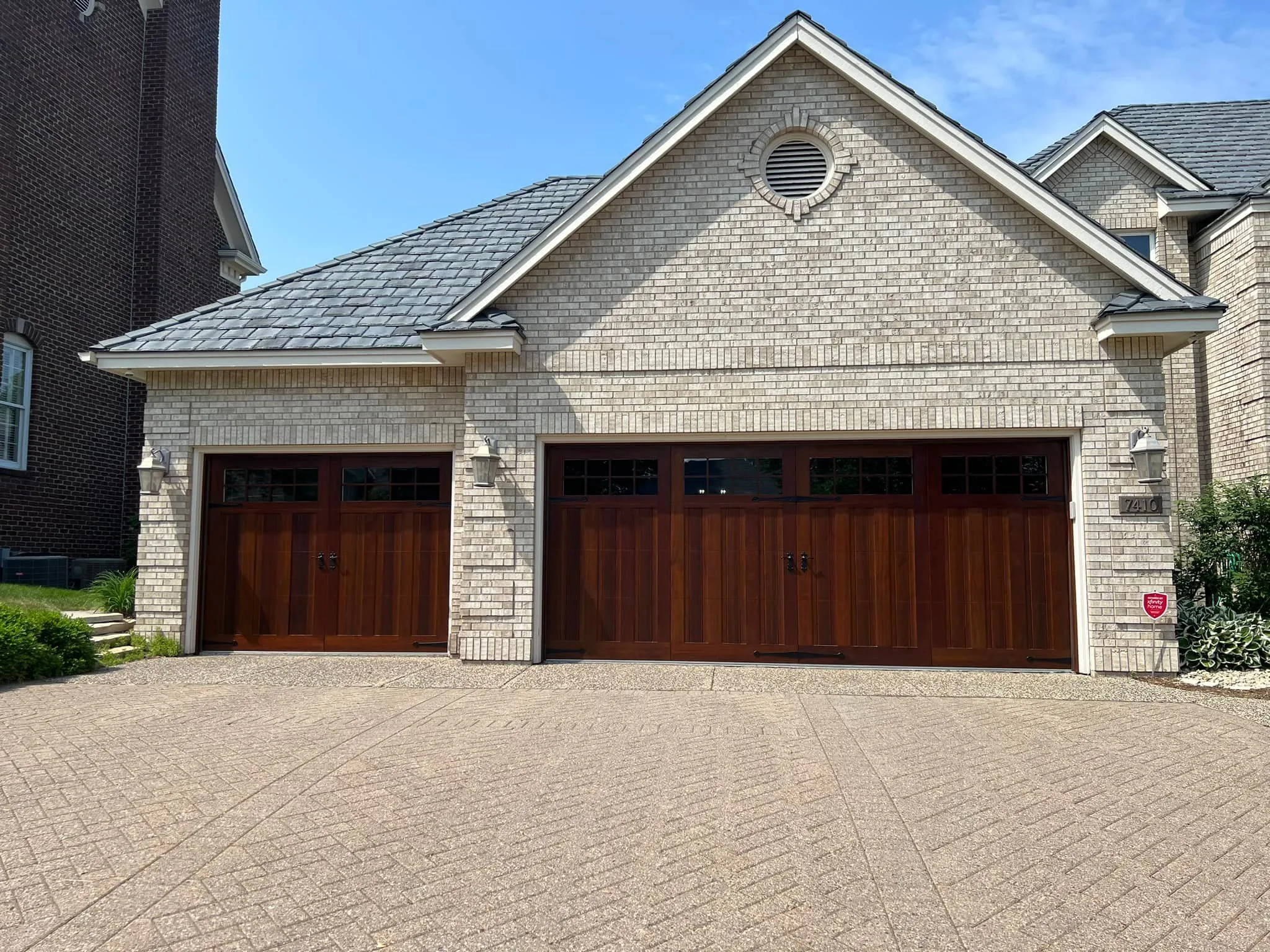 Old garage door ready for replacement in Bryan TX