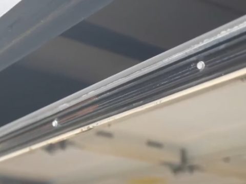 An aluminum bottom seal track on a garage door